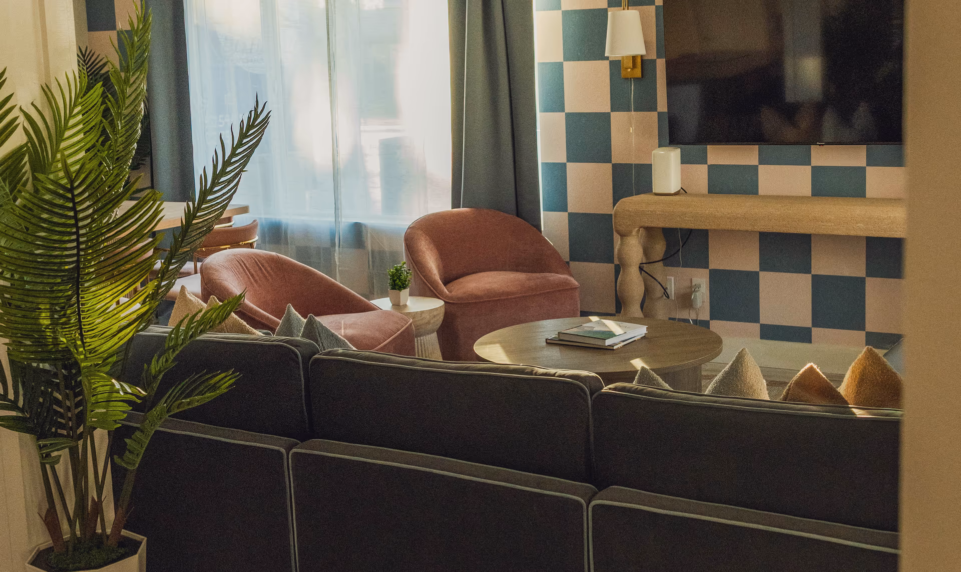 Short-term rental living room with checkered accent wall
